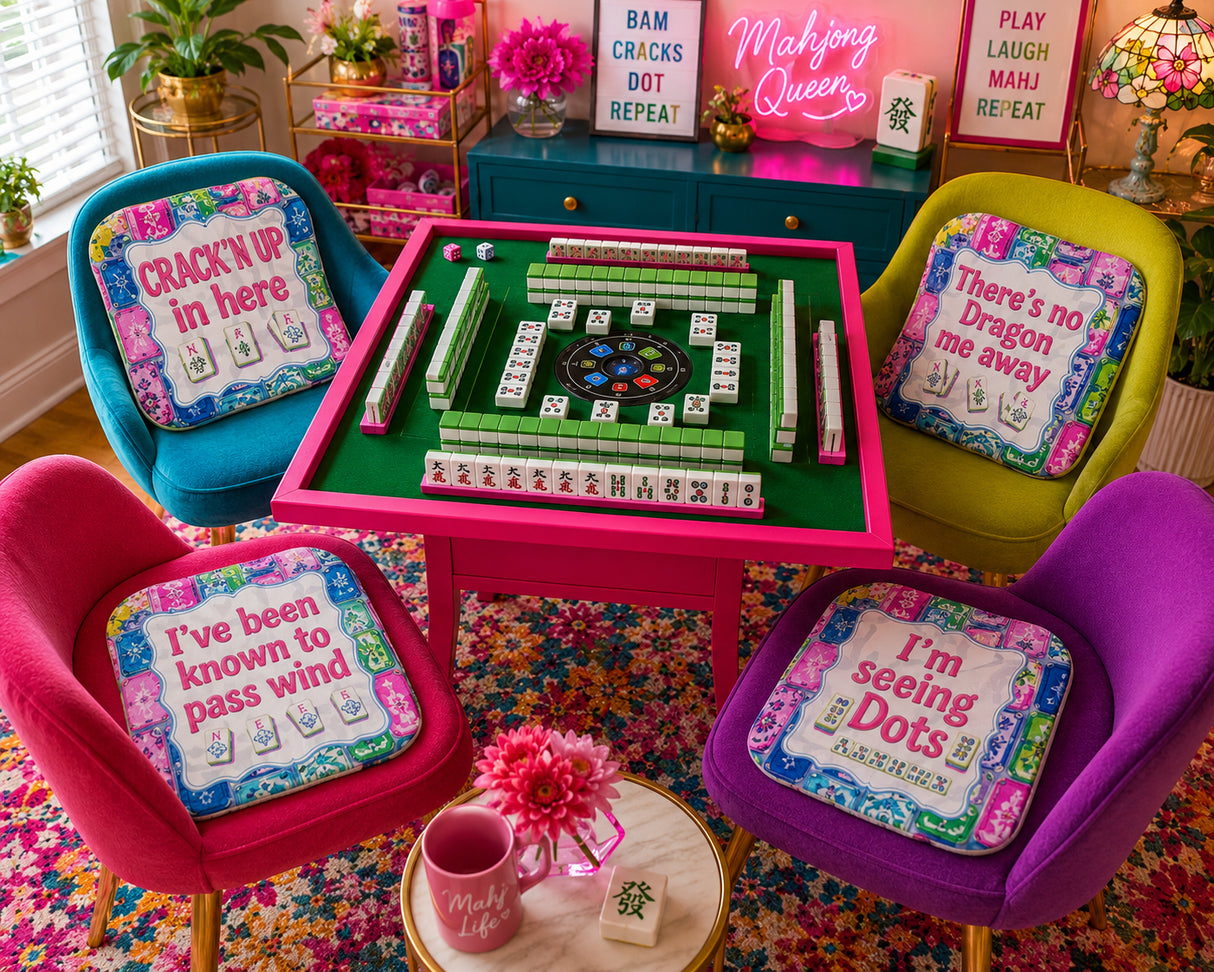Colorful room with a mahjong table and decorative chairs with humorous cushions.