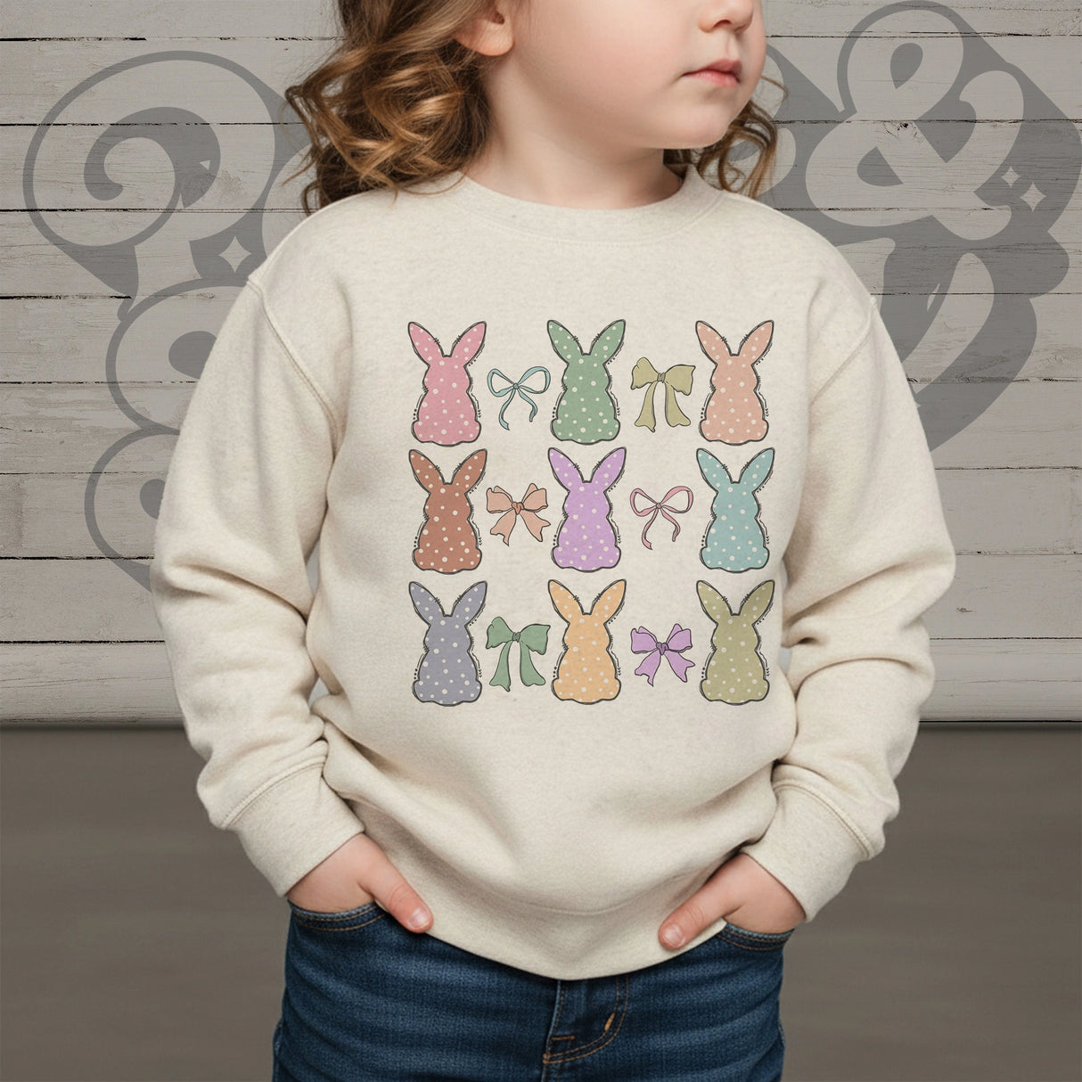 Multi colored bunny collage on kids natural colored sweatshirt