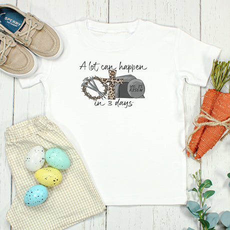 Tshirt with Easter-themed decorations on a wooden surface
