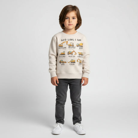 Child wearing a beige sweatshirt with text and graphics on a white background 
Kids natural colored sweatshirt with God Says I Am design with construction vehicles above affirmations and bibles verses to match the wordbackground