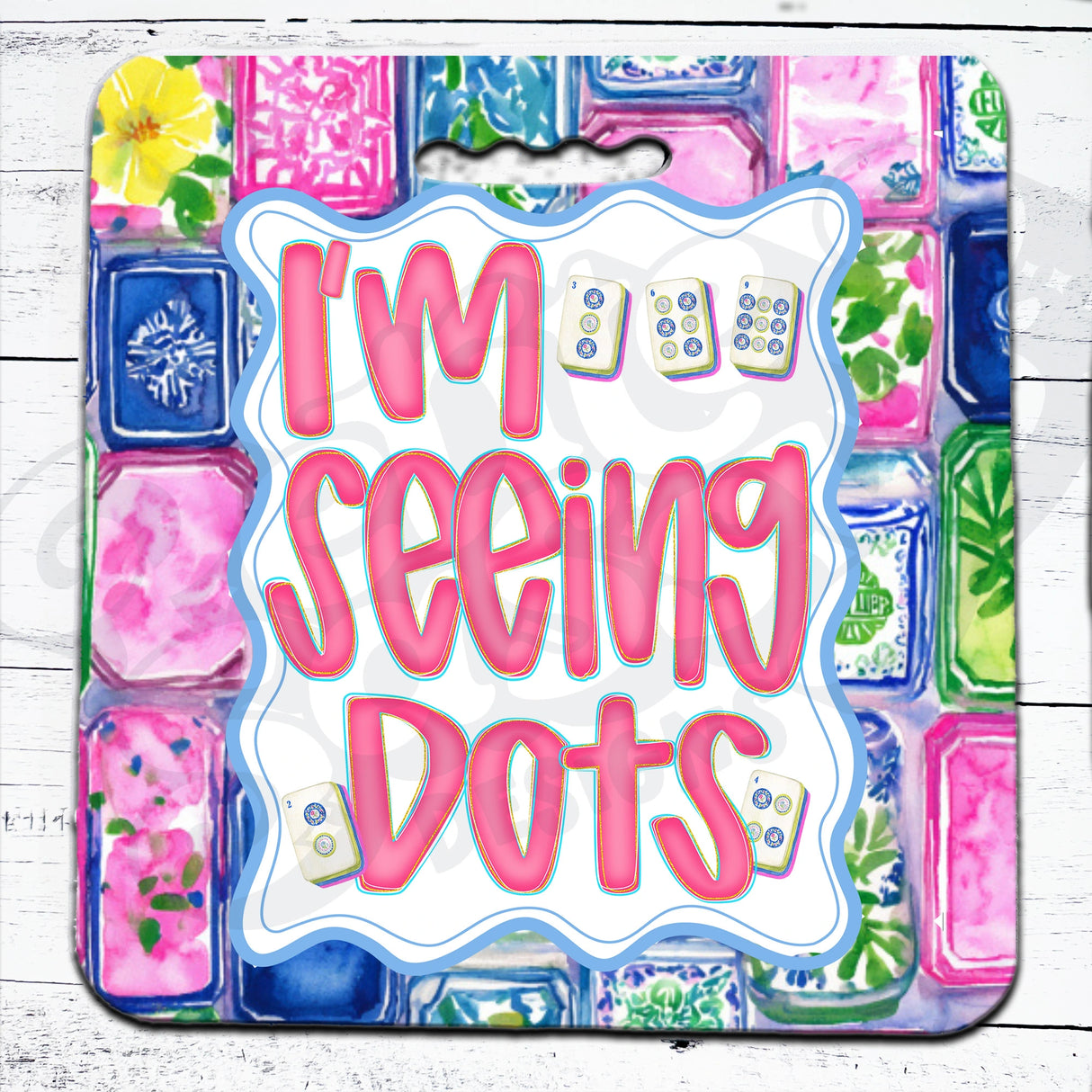 Colorful packaging of 'I'm Seeing Dots' with floral and geometric patterns on a mahjong seat cushion 
