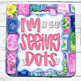 Colorful packaging of 'I'm Seeing Dots' with floral and geometric patterns on a mahjong seat cushion 