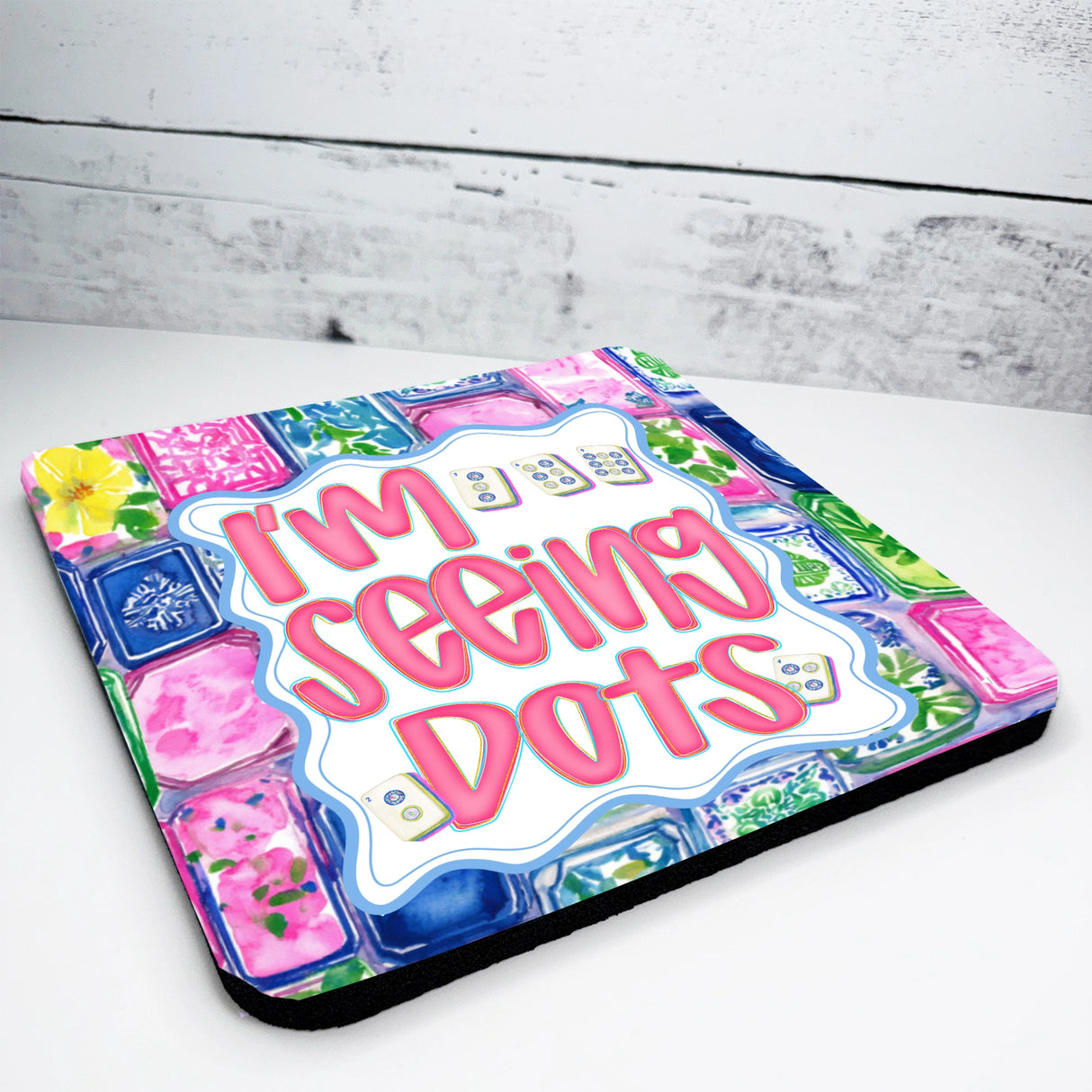 Colorful mahjong seat cushion with 'I'm Seeing Dots' text on a wooden surface