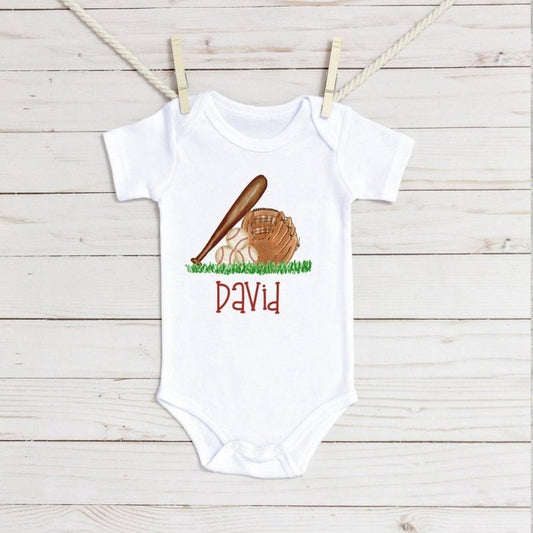 Baseball Bat & Glove Infant Bodysuit - Petite & Sassy Designs Any little brother or sister can show their support by wearing this baseball bat & glove infant bodysuit. Pair with a little baseball hat.